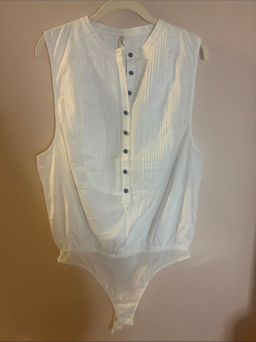 Sleeveless White Pintuck Button-Front Bodysuit